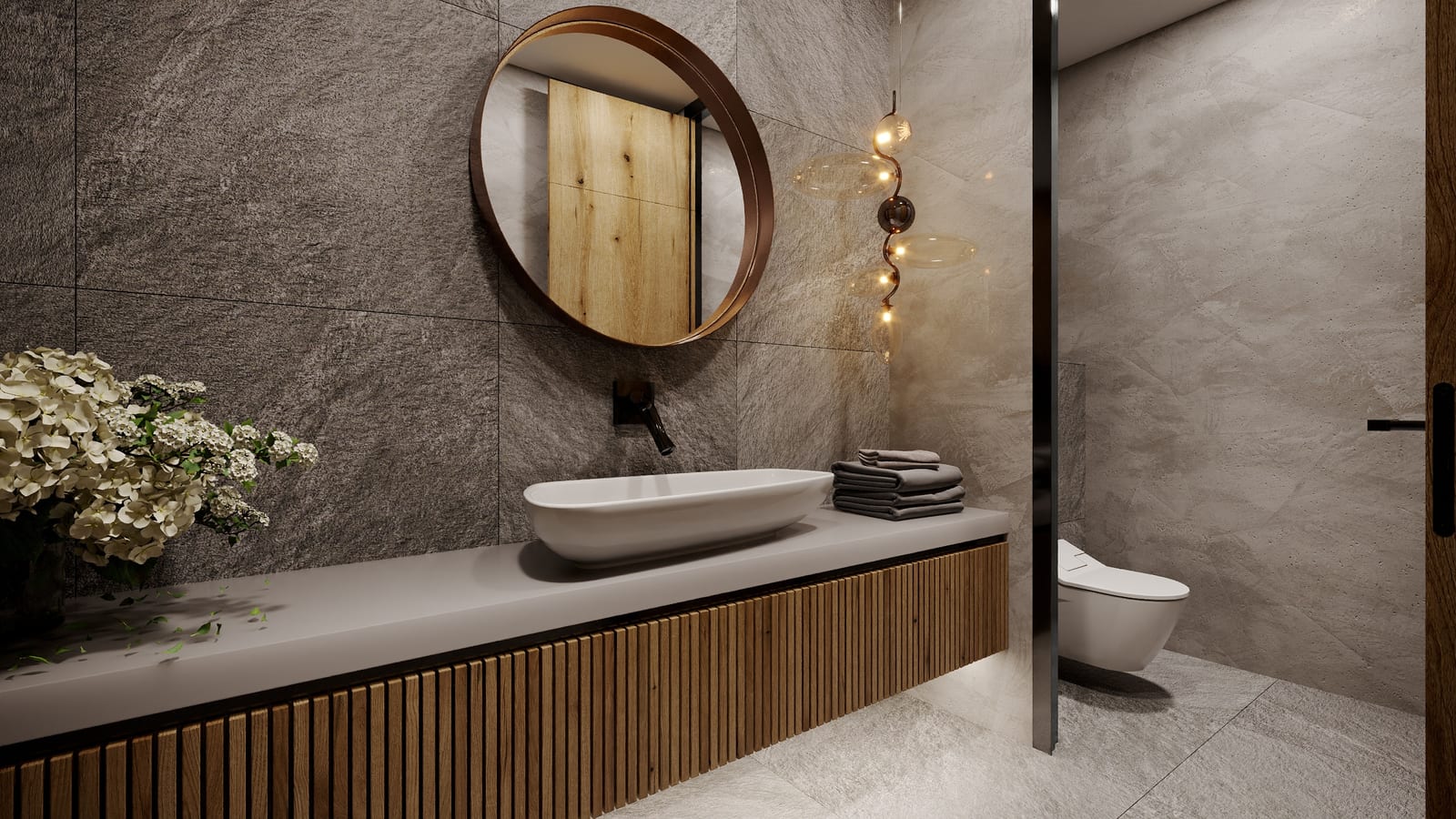 Detail umyvadla s věšákem ručníků a designovým osvětlením, hygienické zázemí Olomouc